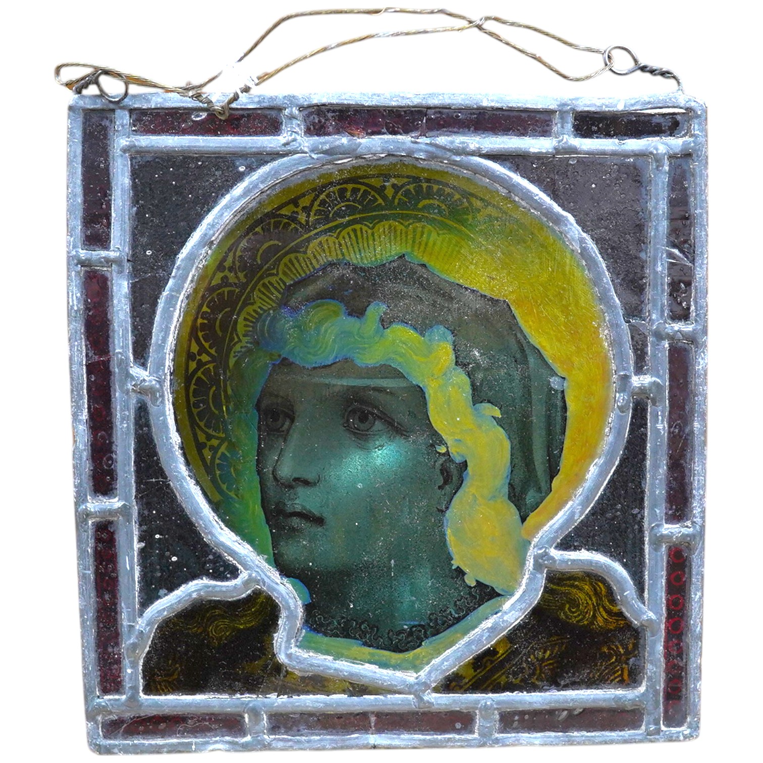 A stained glass panel showing the head of a saint, 21 x 20cm. Condition - four panels cracked